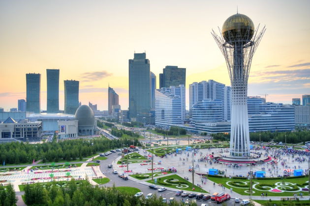 Bayterek Tower and modern skyline of Astana Kazakhstan at sunset