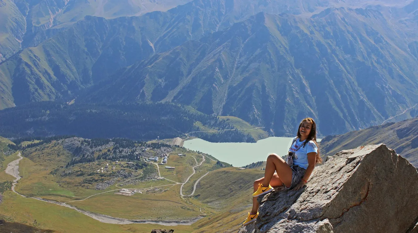 Turquoise Big Almaty Lake surrounded by snow-capped Tien Shan mountains